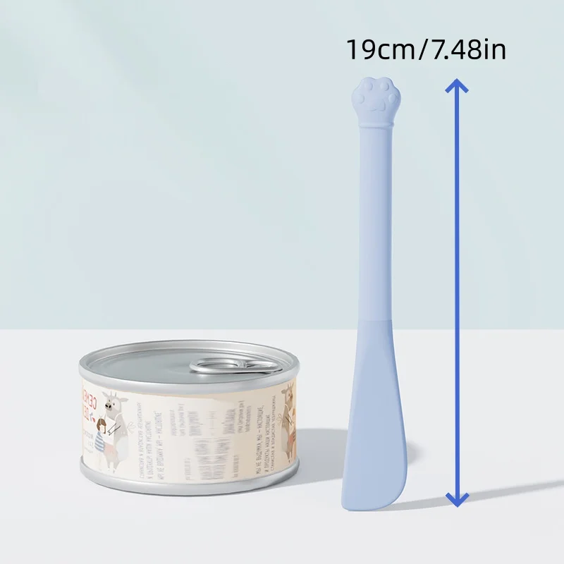 {title} — long-handled can scoop and lid opener next to an opened can of wet cat food