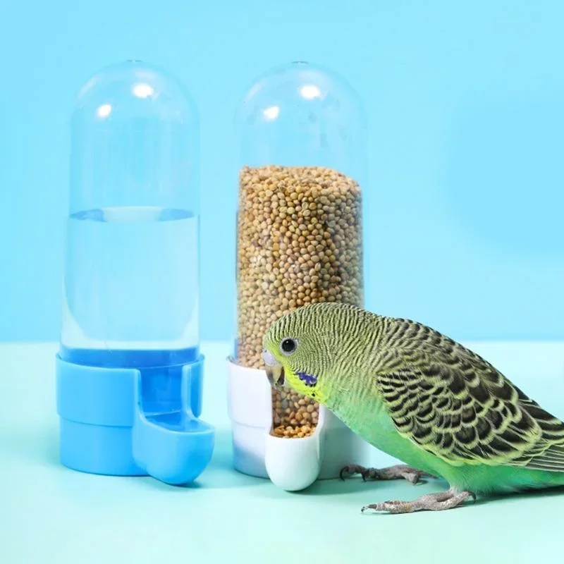 Hanging bird feeder and water dispenser attached to cage, showing food box and water area – view 2