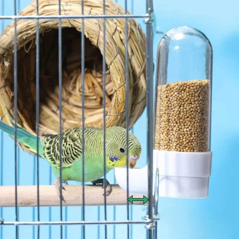 Hanging bird feeder and water dispenser attached to cage, showing food box and water area – view 3
